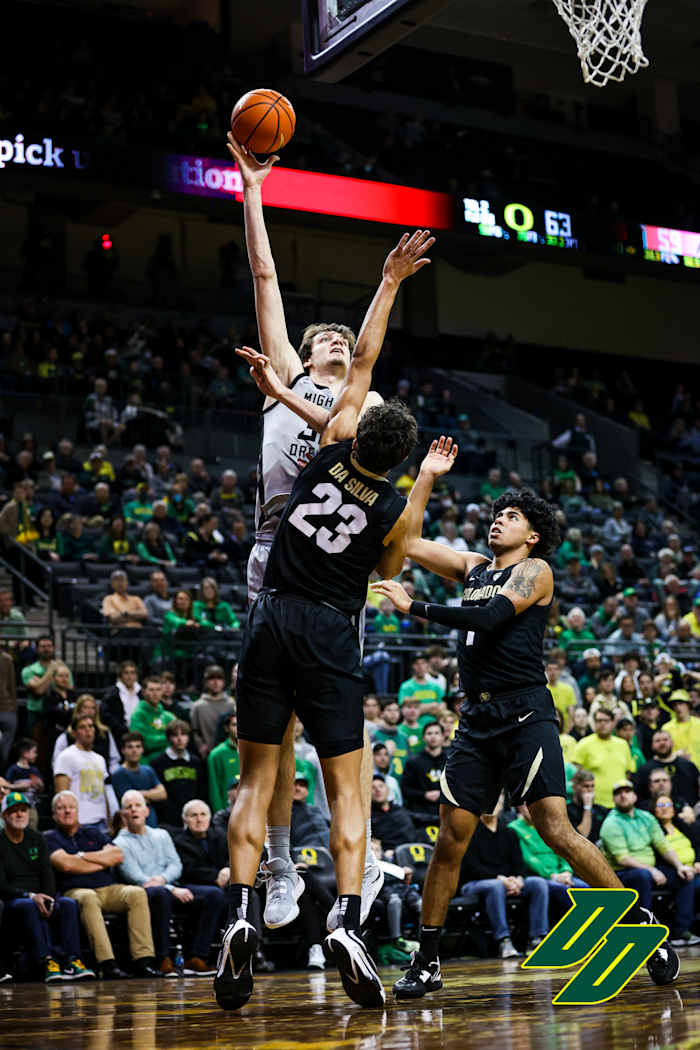 Nathan Bittle shoots a hook shot against the Colorado Buffaloes.